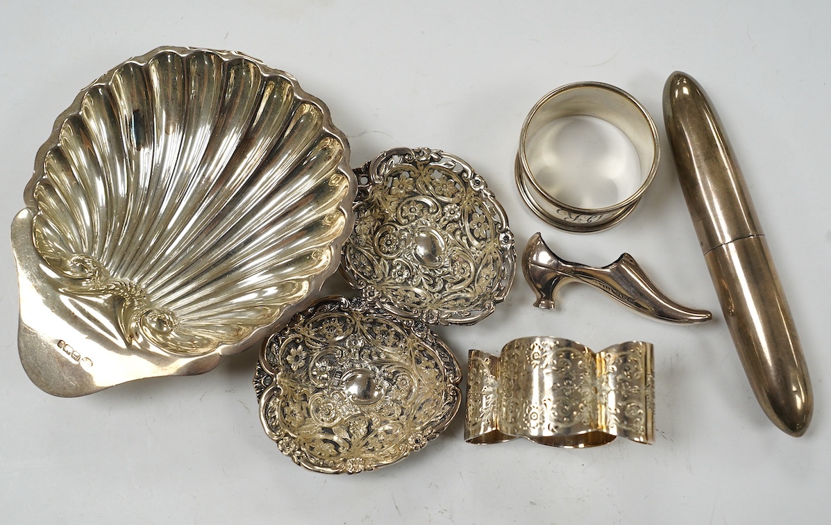 Sundry small silver, including a butter shell, napkin ring, pair of bon-bon dishes, shoe pin cushion and a late Victorian torpedo shaped single cigar case, Birmingham, 1900, 12.9cm. Condition - fair to good